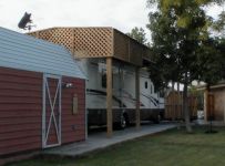 RV cover covered w/cedar and lattice.